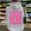 Hooded long sleeved fleece sweatshirt with Faith Over Fear print
