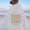 Hooded long sleeved fleece sweatshirt with Faith over fear print