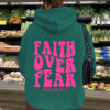 Hooded long sleeved fleece sweatshirt with Faith Over Fear print