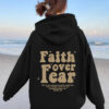 Hooded long sleeved fleece sweatshirt with Faith over fear print