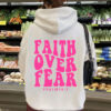 Hooded long sleeved fleece sweatshirt with Faith Over Fear print